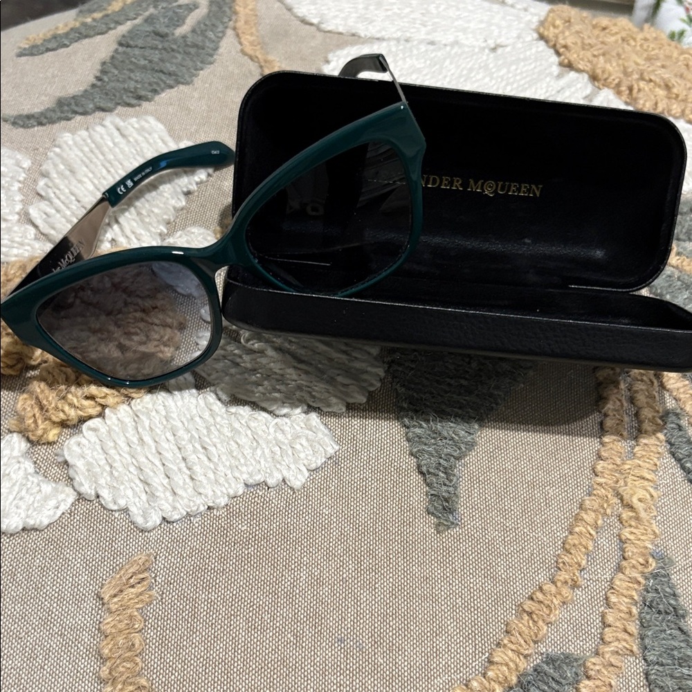 Alexander McQueen Teal Women's Glasses
Hard shell case included
Like new!!